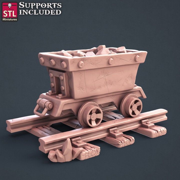 an image of a toy train set with wheels and carts on the tracks for scale