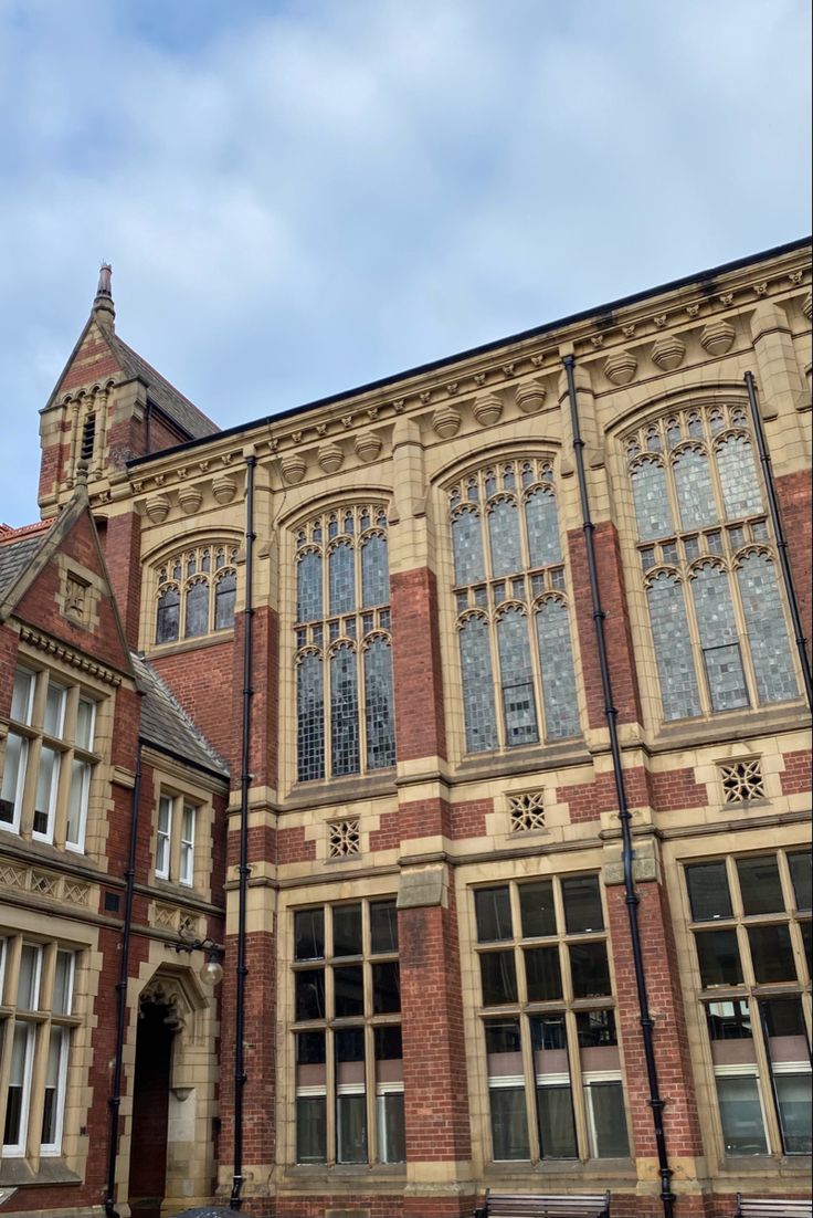 an old building with many windows and a clock tower