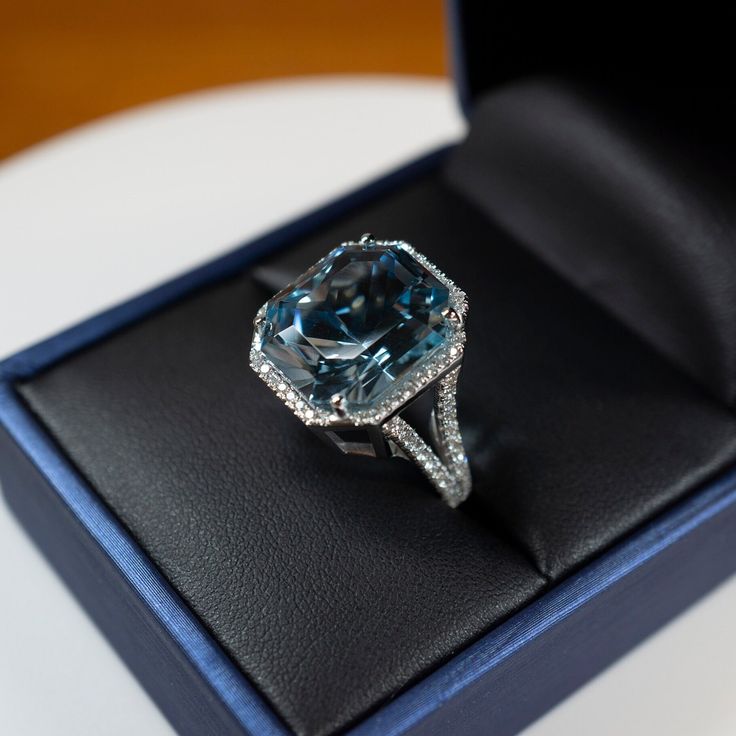 Massive Blue Aquamarine Ring, 14K white Gold, Diamond Halo, Custom Cut Gemstone! Emerald cut Natural blue  Aquamarine, 12.88.00 Carat, VVS+ grade no visible inclusion,  Amazing Stone! lots of sparkle! Perfect Blue Genuine natural diamonds in a Halo & split band design.  I've had this ring appraised and it's valued at $10,700   I personally Faceted this stone, it is timely polished with Oxide so shines better than most commercial gems. i hope the Images do it justice, it really is a amazing ring.. please see video also.  enjoy :) Stone Measurements:  15.47mm X 14.09mm  Custom Cut Gemstone weight: 12.88 Ct Natural Aquamarine Natural Diamonds: 0.680 Cts Ring Material: 14k White gold Ring Weight: 9.10 grams Ring Size: 6.75 Sorry but the ring only comes in this size, If you really like it i'm s Luxury Aquamarine Gemstone Diamond Ring, Luxury Light Blue Aquamarine Rings, Luxury Blue Aquamarine Rings, Luxury Blue Aquamarine Diamond Ring, Luxury Octagon Aquamarine Ring, Blue Aquamarine Ring, Perfect Blue, Band Design, Aquamarine Ring