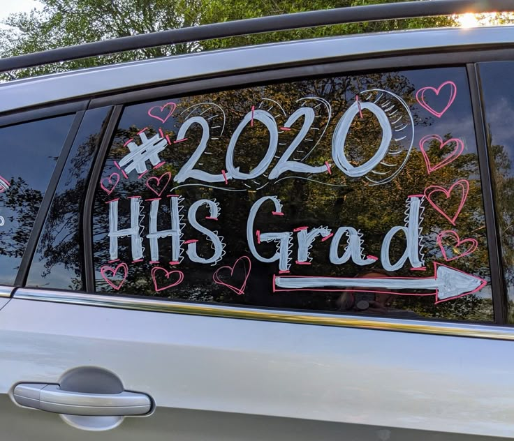 a car that has been decorated with hearts and the words his grad written on it