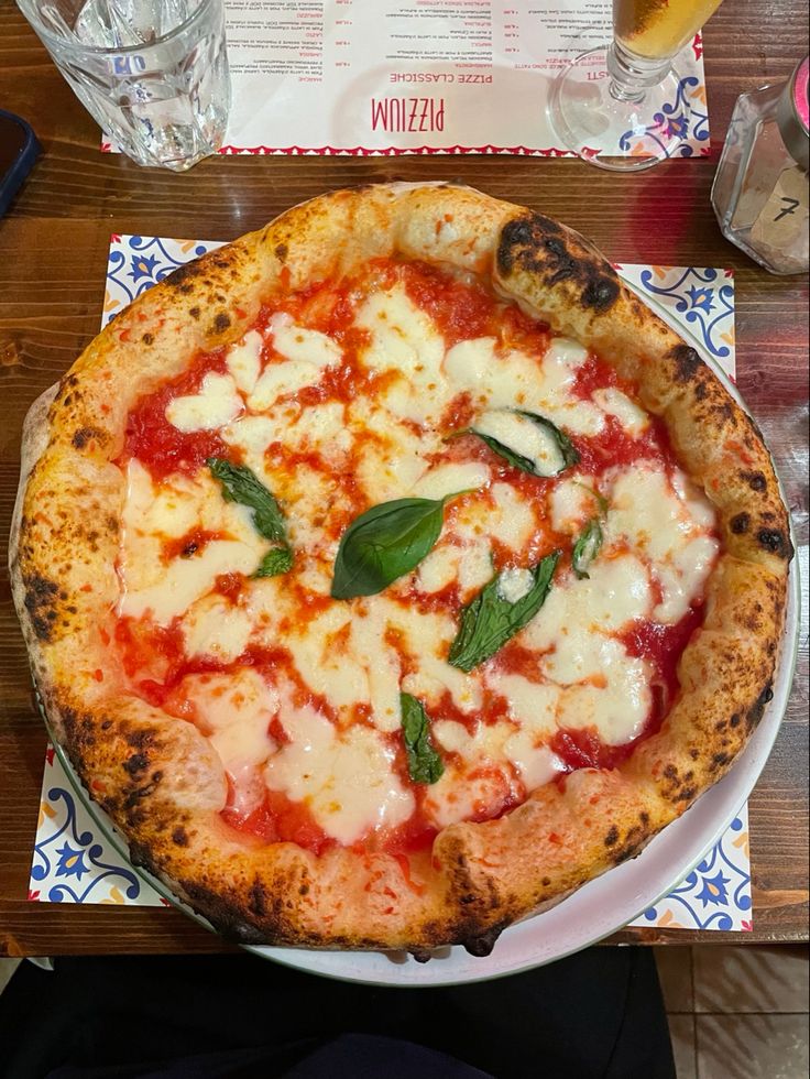 a pizza sitting on top of a white plate