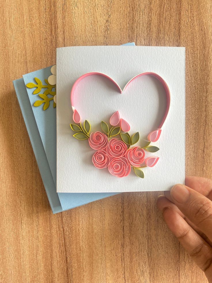 handmade greeting card with paper flowers and heart