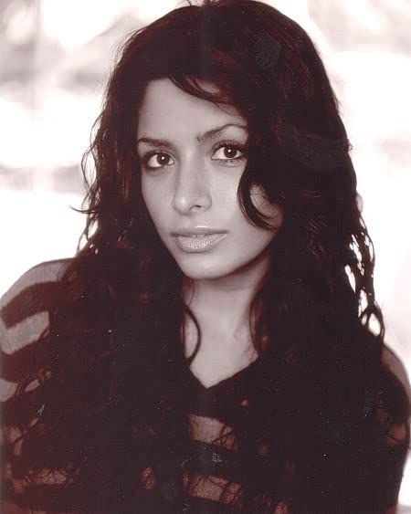 a black and white photo of a woman with long hair