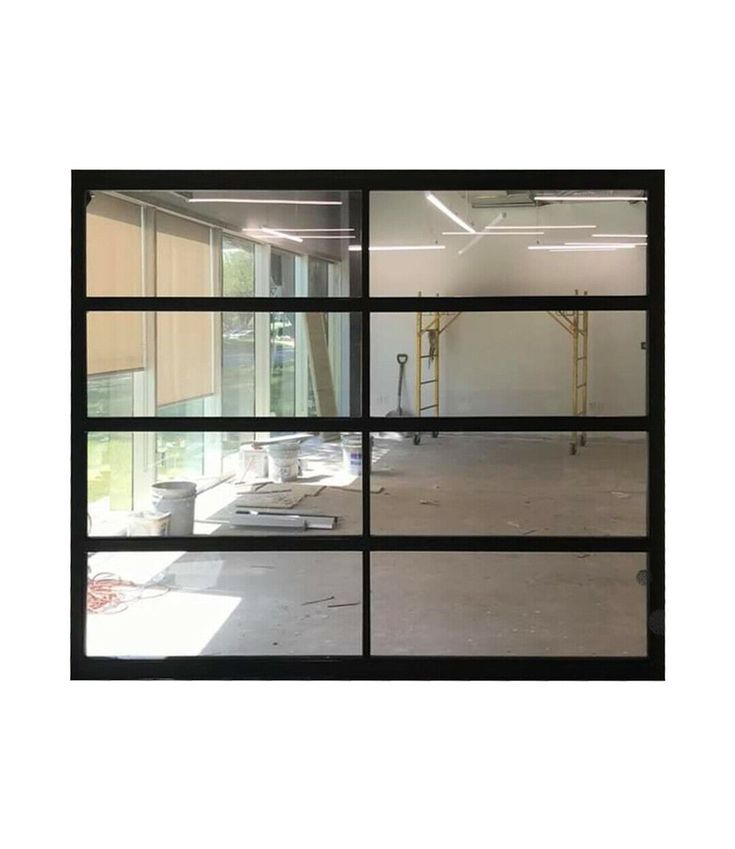 an empty room with multiple windows in it