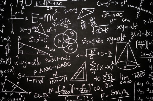 a blackboard with lots of white writing on it and some calculations written in chalk