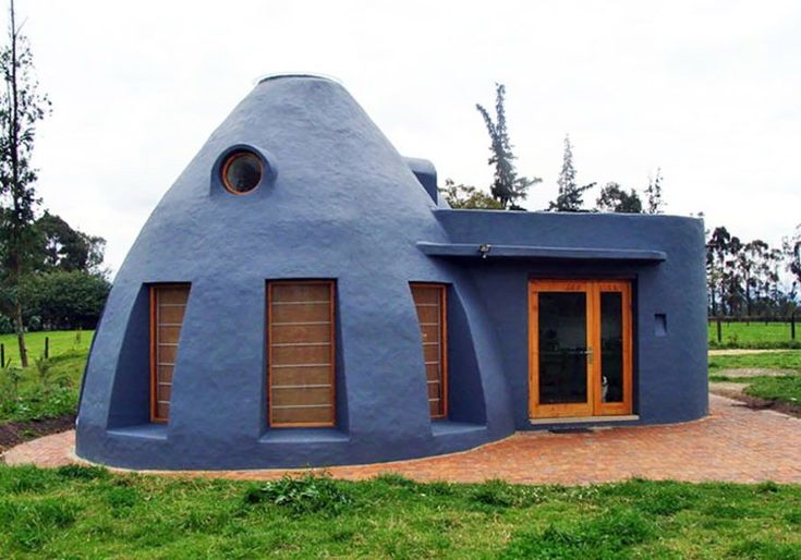 a house made out of cement and wood