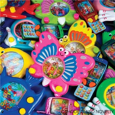 many different toys are piled together in the shape of a flower, butterfly and other things