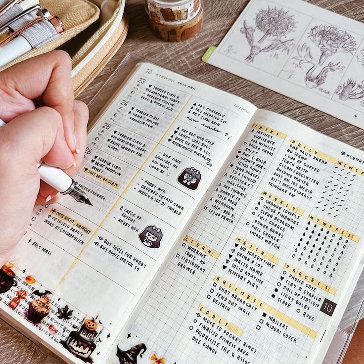 a person is writing in a planner on a table