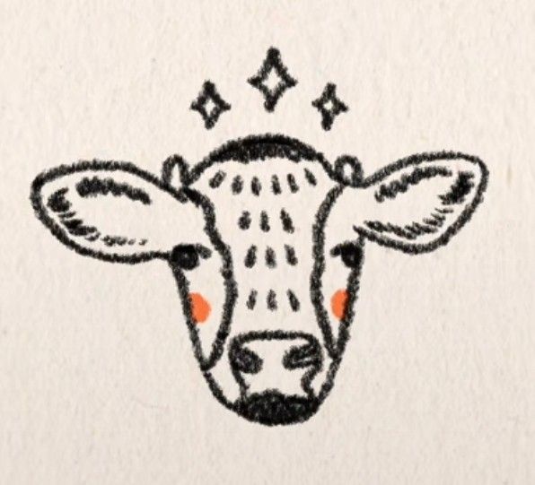 a drawing of a cow's head with stars on its forehead and eyes drawn in black ink