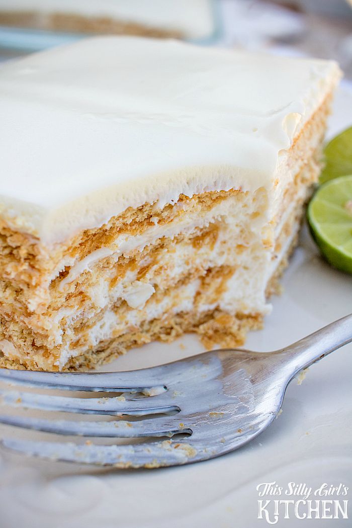 a close up of a piece of cake on a plate with a fork next to it