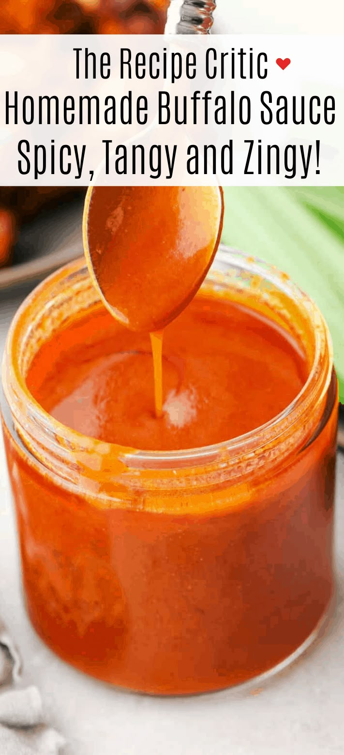 a spoon full of homemade buffalo sauce being poured into a jar with text overlay reading the recipe circle homemade buffalo sauce spicy, tangy and zing