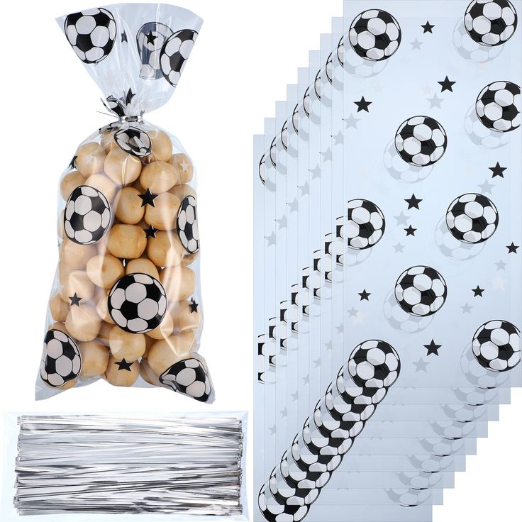 soccer balls and stickers are in a bag next to some other items on the table