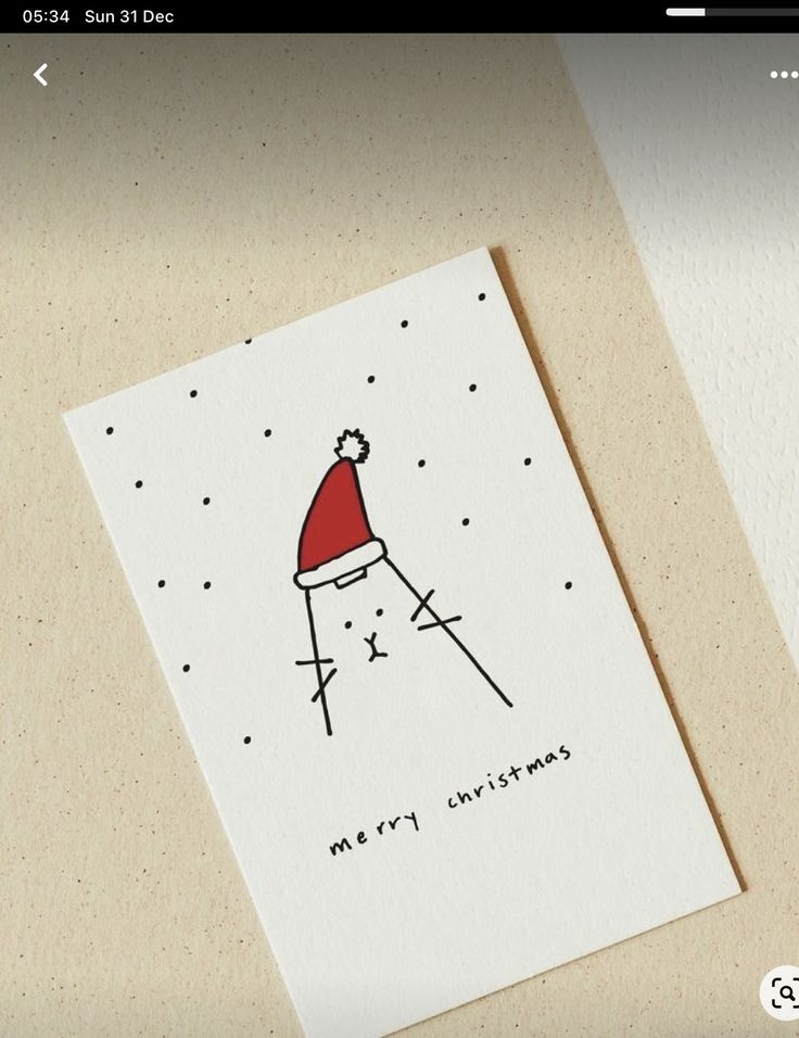 a christmas card with a santa hat on it