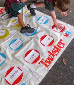 two young boys playing with a sign on the ground