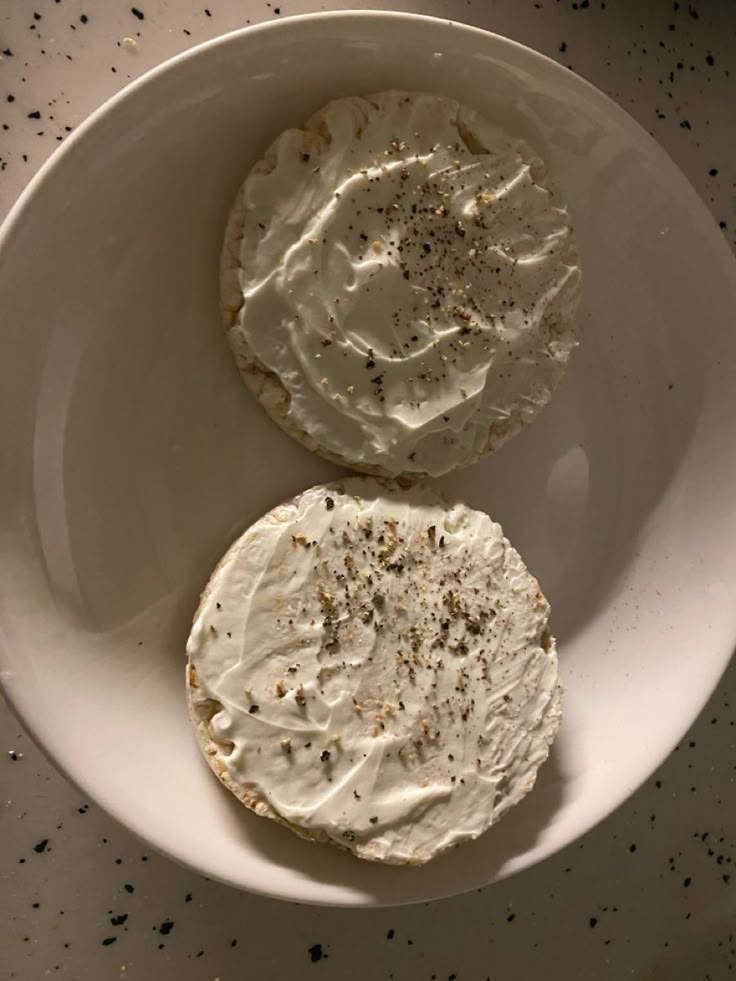 two pieces of cake sitting on top of a white plate