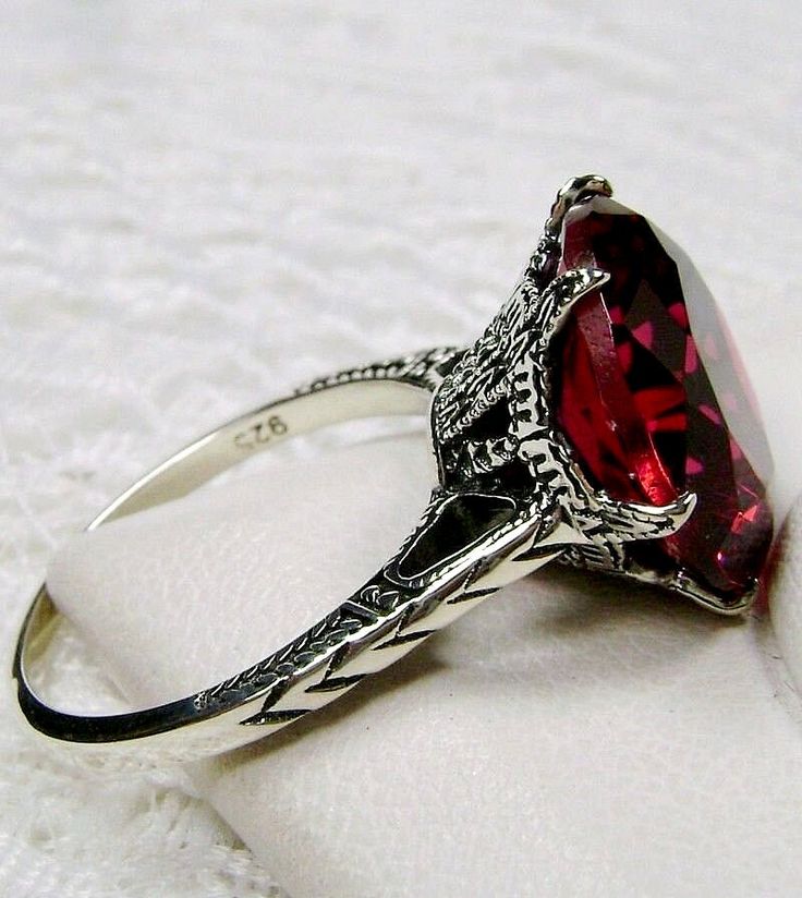 Simulated Red Ruby Ring Description 100 Year Design#37 Custom This is a brand new Edwardian reproduction filigree ring in antiqued solid sterling silver. The round full cut high quality Simulated/man-made red ruby gemstone is 12mm (1/2th of an inch) in diameter. The inside of the band is marked 925 for sterling. Notice the beautiful intricate crown like design of the silver filigree setting and etched band. The original ring I bought in this exact design was from 1910. This is a rare and exact r Red Ruby Ring, Rubin Ring, Unique Rings Vintage, Edwardian Jewelry, Filigree Ring, Victorian Jewelry, Ruby Gemstone, Red Ruby, Engraved Items