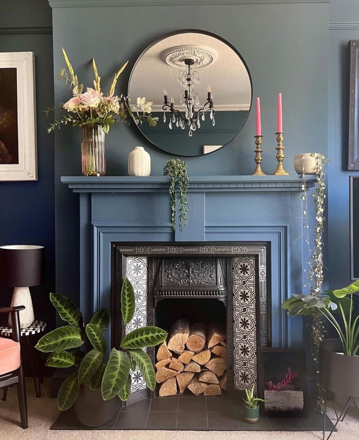 a living room filled with furniture and a fire place next to a wall mounted mirror