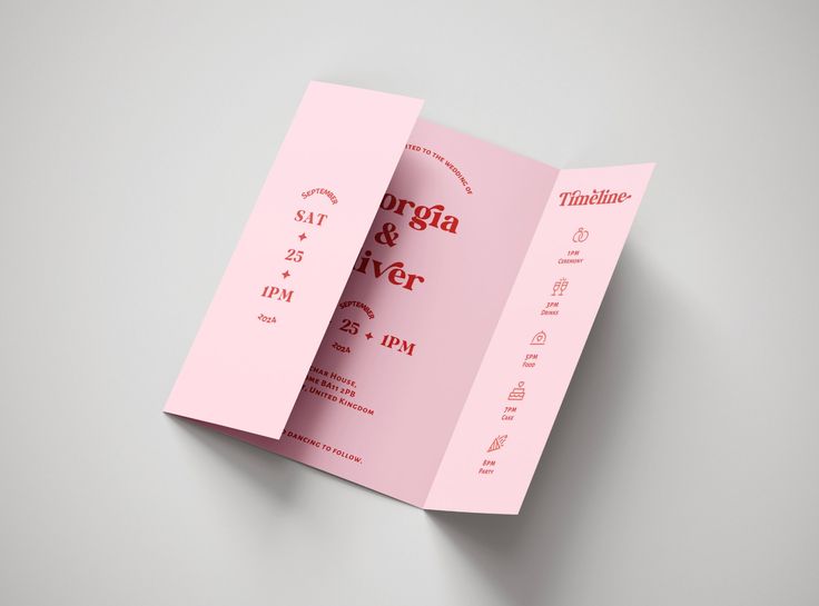 an open pink brochure on a gray background