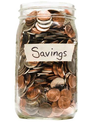 a jar filled with lots of coins and the word savings written on it's label