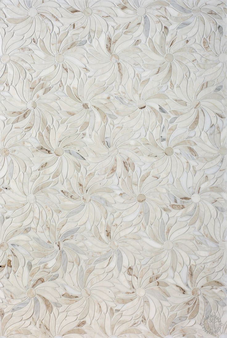 a white rug with leaves on it