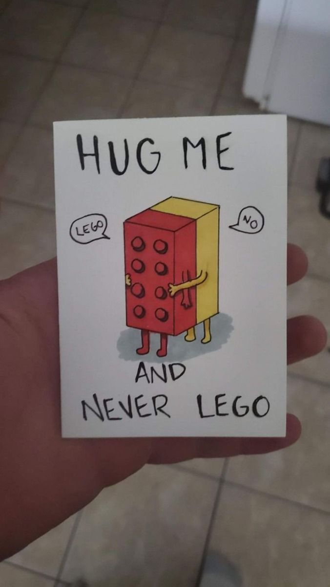 someone is holding up a card that says hug me and never lego