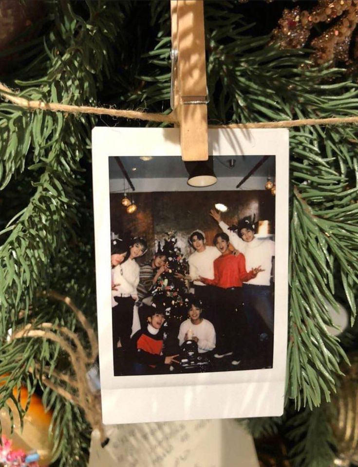 an old photo hanging on a christmas tree