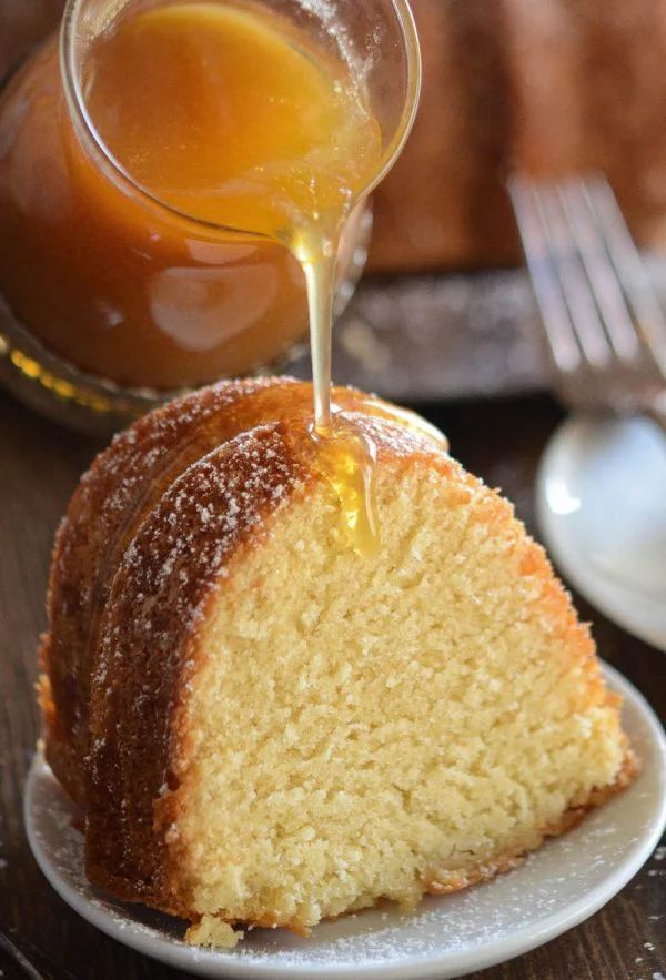 a piece of cake is being drizzled with honey