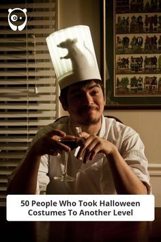 a man wearing a chef's hat sitting at a table