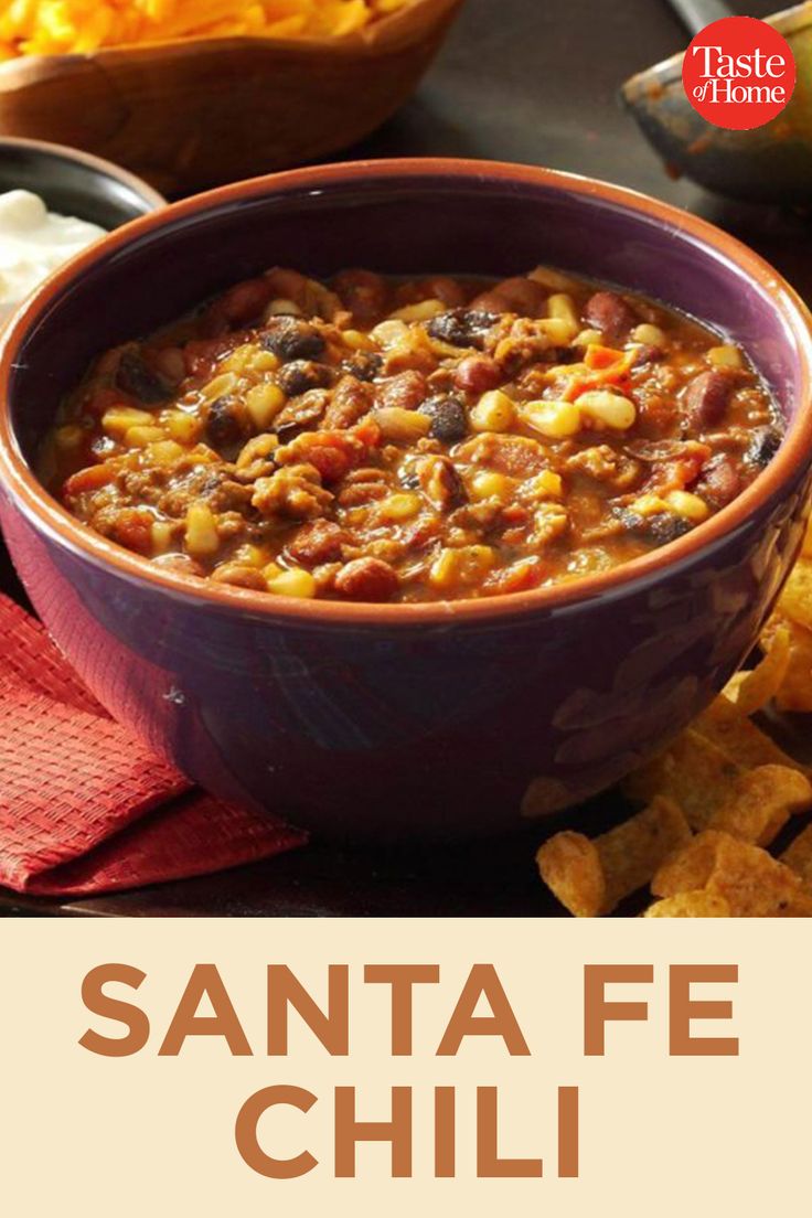 a bowl of chili with corn and tortilla chips