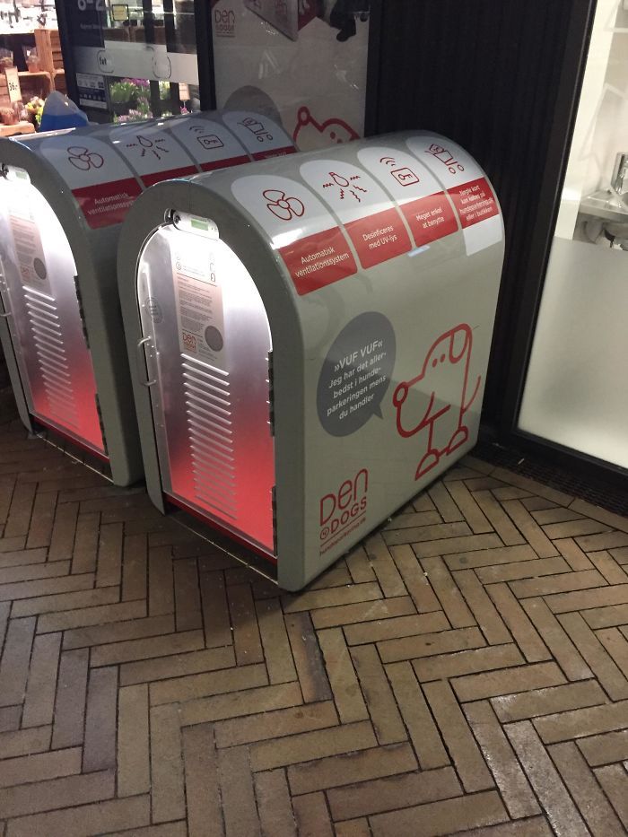 two vending machines sitting next to each other on the floor in front of a store