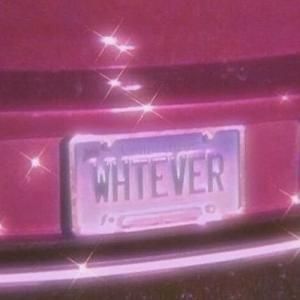 the license plate on this pink car is very bright and shines with sparkles