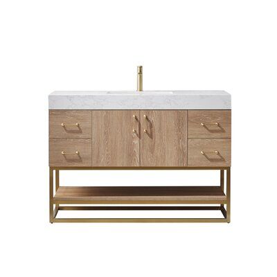 a bathroom vanity with two drawers and a marble counter top in light wood, against a white background