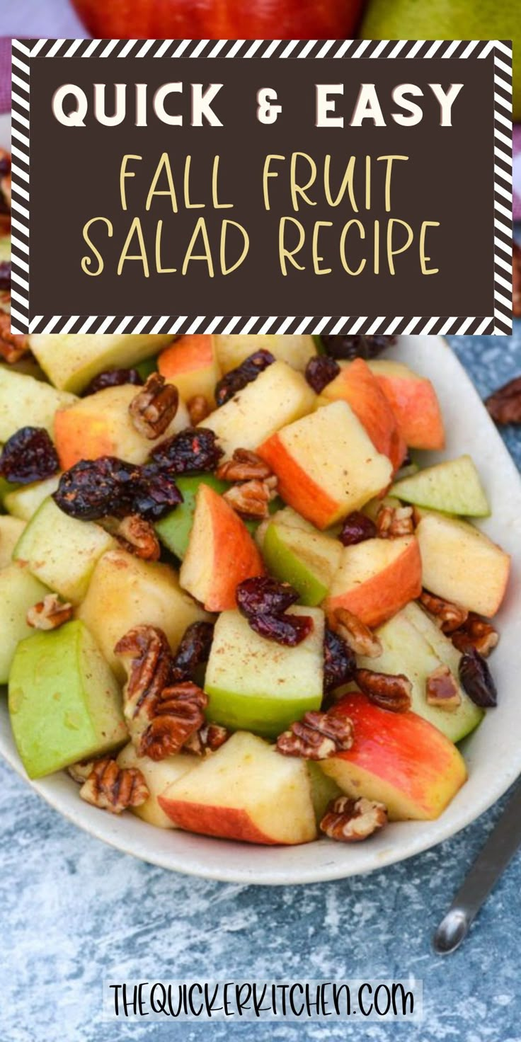 a white bowl filled with fruit and nuts on top of a blue tablecloth next to an apple