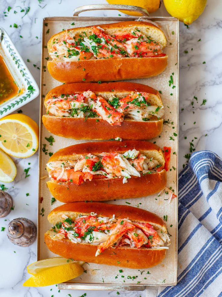 lobster in bread with lemons and parsley on the side