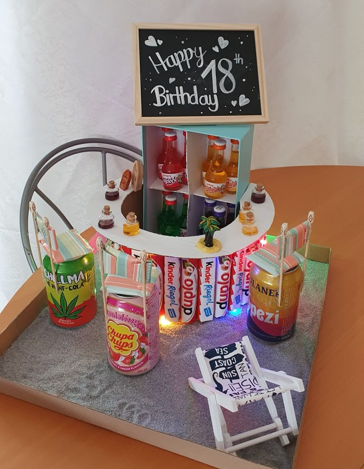 an assortment of drinks and condiments on a table with a happy birthday sign