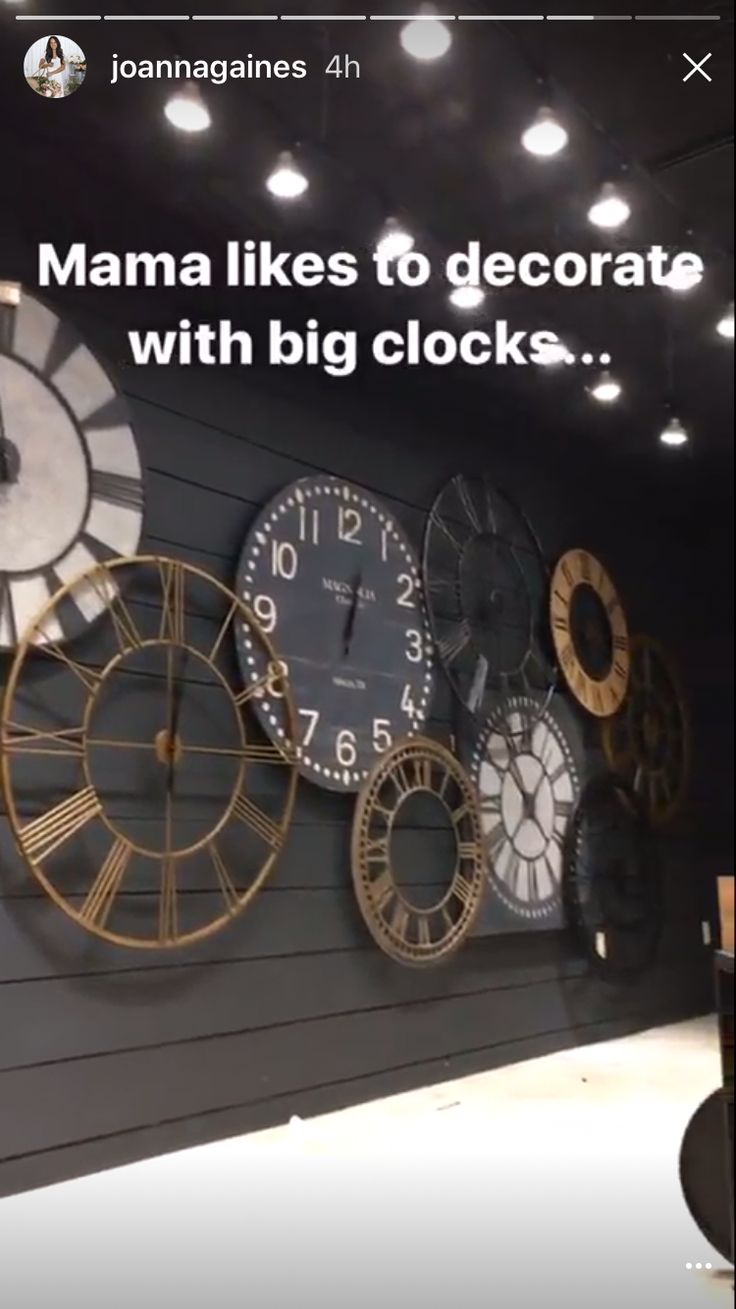 there are many clocks on the wall in this shop front window display, with caption that reads mama likes to decorate with big clocks