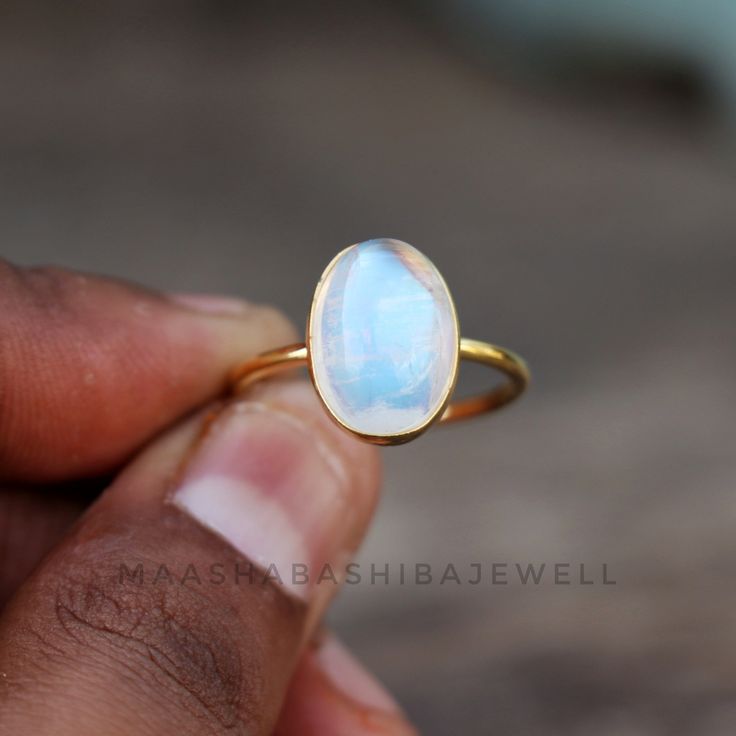 Natural Moonstone Ring, Solitaire Engagement Ring, 18k Gold Vermeil Ring, Birthstone Ring, Rainbow Moonstone Ring, Dainty Weeding Women Ring SHOP LINK:- https://www.etsy.com/shop/MaaShabashibaJewell?ref=seller-platform-mcnav 》D E T A I L S《 Gemstone: Natural Rainbow Moonstone Gem Color: Blue Stone Shape: Oval Metal: 925 Sterling Silver Purity: 925 Parts Per 1000 Setting Type: Bezel Set Silver Polish: High Ring Size: All Size Available Please note that there Can be slight variations in stone text Luxury Gift Moonstone Open Ring, White Moonstone Celestial Ring In 14k Gold, White Celestial Moonstone Ring In 14k Gold, Celestial White 14k Gold Rings, Celestial Wedding Ring With Bezel Setting, Celestial Style Oval Cabochon Gemstone Ring, Celestial Oval Cabochon Gemstone Rings, White Stackable Moonstone Rings With Ethical Gemstones, White Oval Cabochon Moonstone Ring