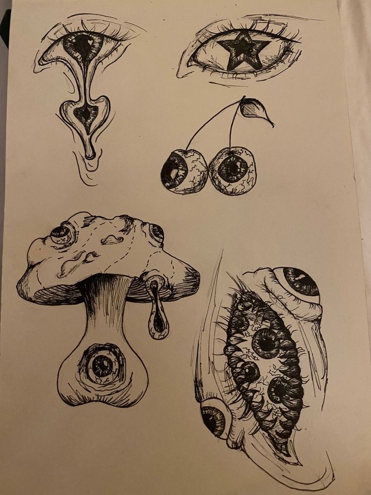 an ink drawing of different types of mushrooms and eyeballs on a piece of paper