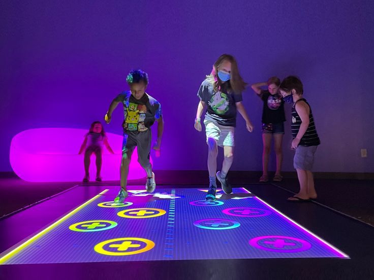 children are playing on an interactive dance floor