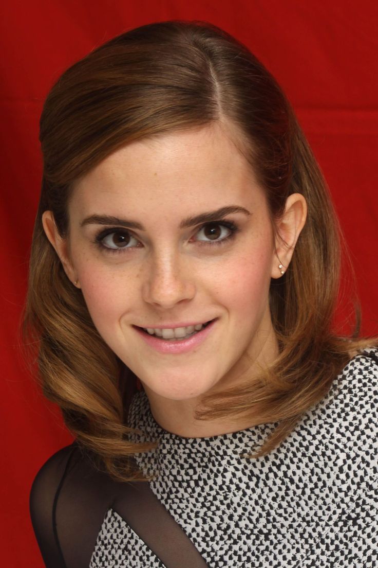 a close up of a person wearing a black and white dress with a red background