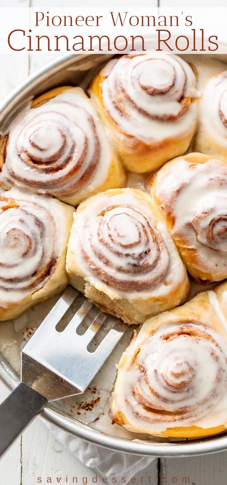 a pan filled with cinnamon rolls on top of a table