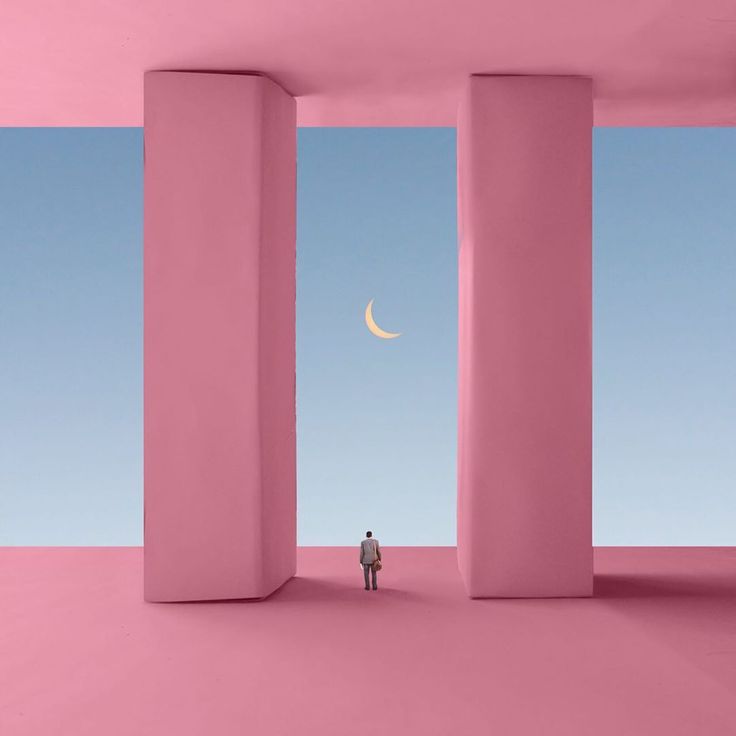 a person standing in an empty room with columns and a half moon at the end