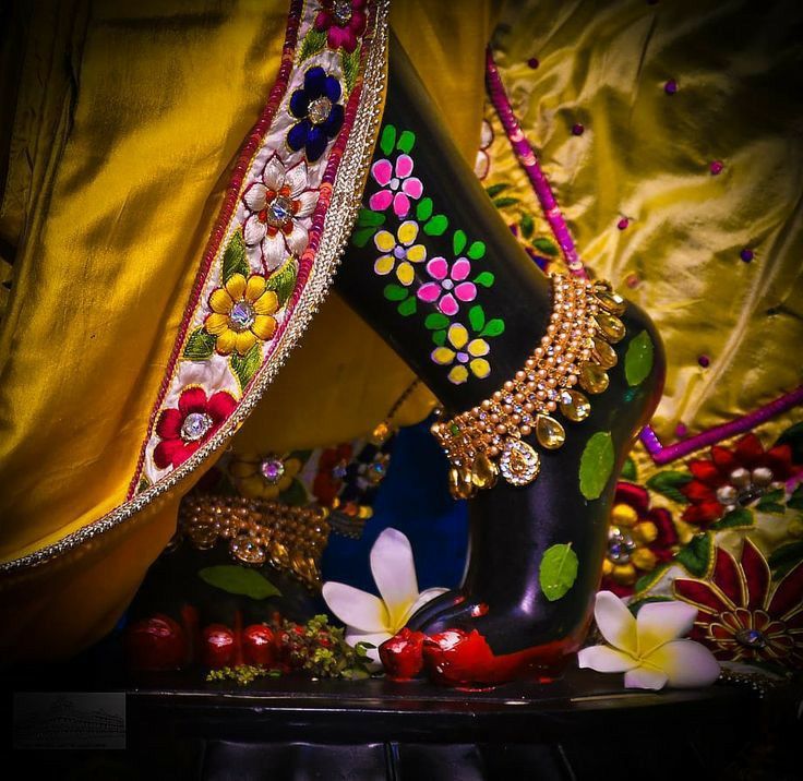 an elaborately decorated shoe sits on a table