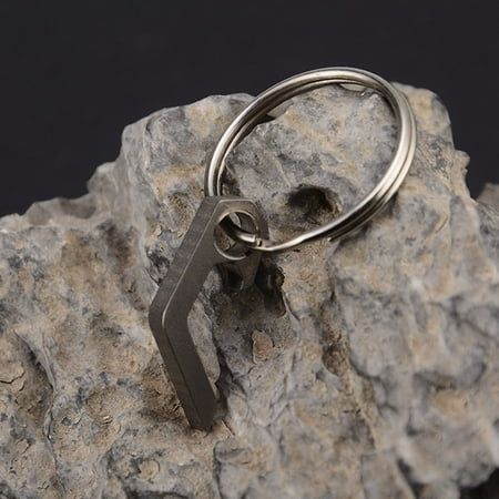 a pair of scissors sitting on top of a rock