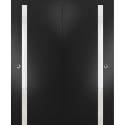 an open black door with white trim and two lights on each side, in front of a white background