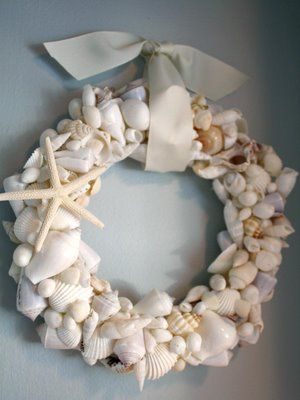 a wreath made out of seashells and starfish