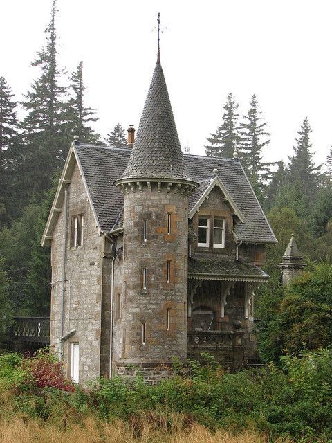 an old castle like building with a tower