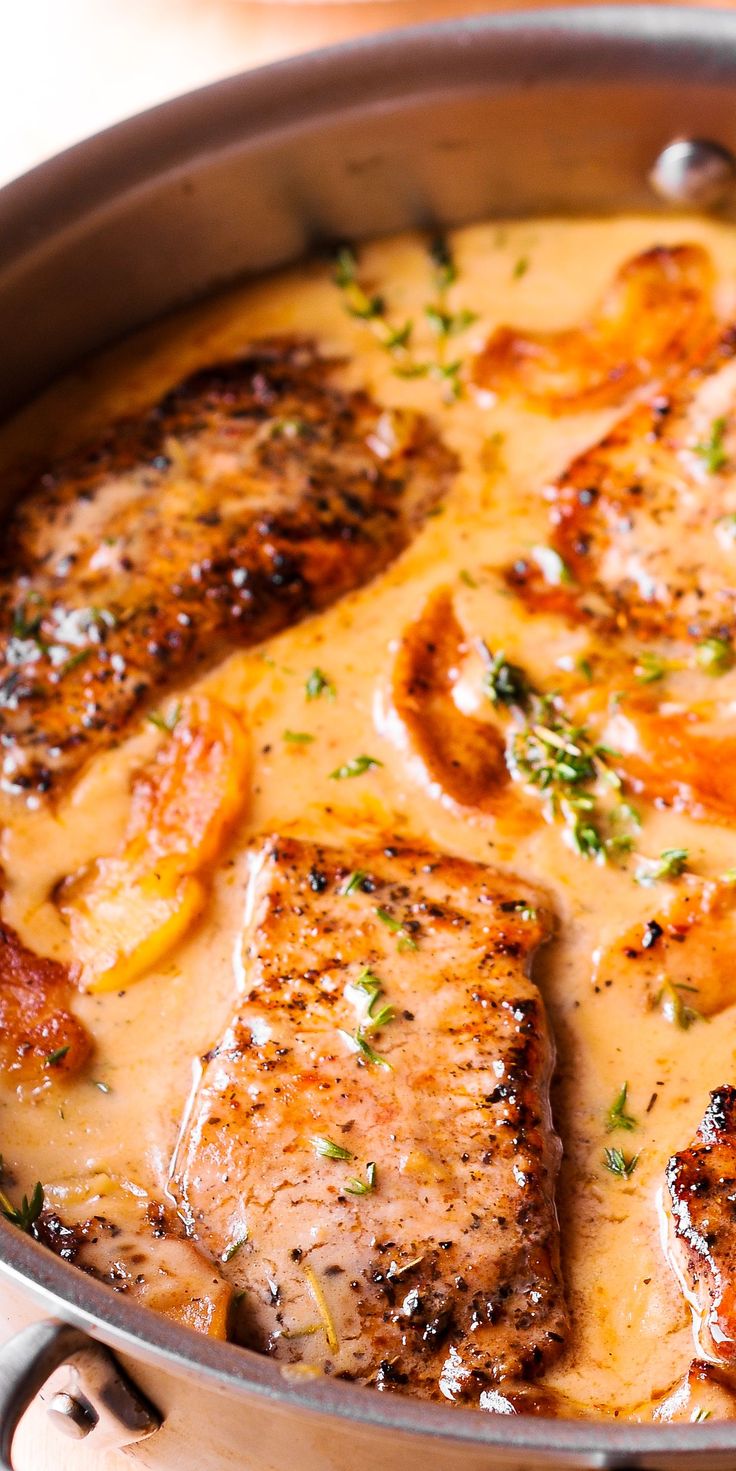 pork chops in sauce with apples in a pan Cider Pork Chops, Apple Cider Pork Chops, Apple Cider Pork, Pork Chops With Apples, Pork Dinners, Pork Sauce, Apple Pork, Apple Pork Chops, Pork Chop Recipes Baked