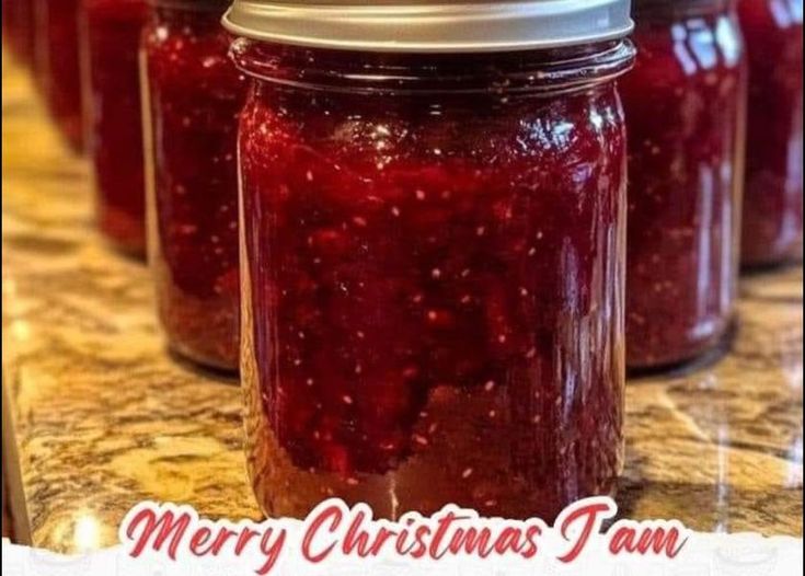 jars filled with jam sitting on top of a counter next to the words merry christmas jam