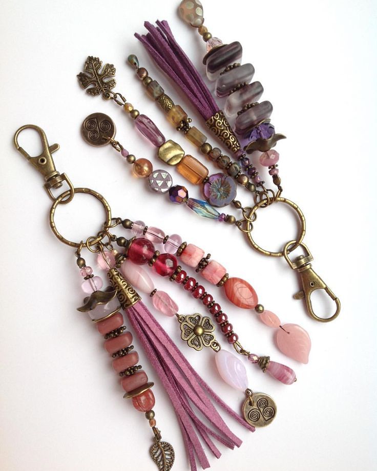 the key chain is decorated with charms and beads